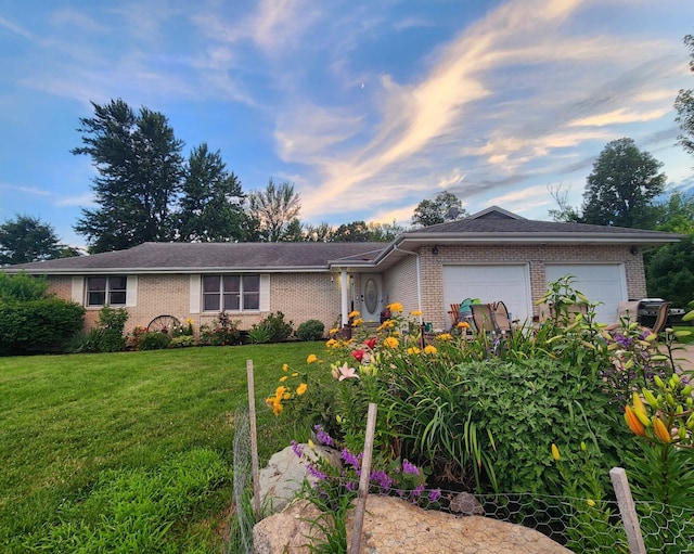 9265 Mulliken Rd, Mulliken, MI 48861 - ranch-style house with brick siding, an attached garage, and a front yard