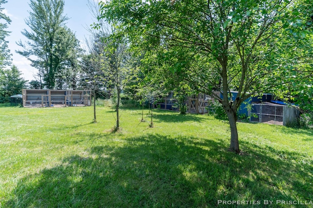 9265 Mulliken Rd, Mulliken, MI 48861 - view of yard with an outbuilding and exterior structure