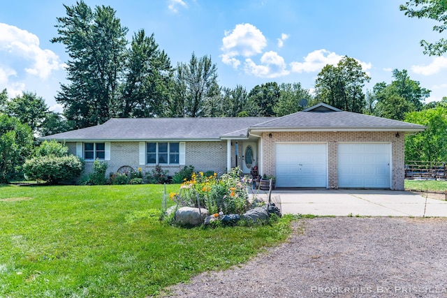 9265 Mulliken Rd, Mulliken, MI 48861 - single story home with concrete driveway, an attached garage, and brick siding