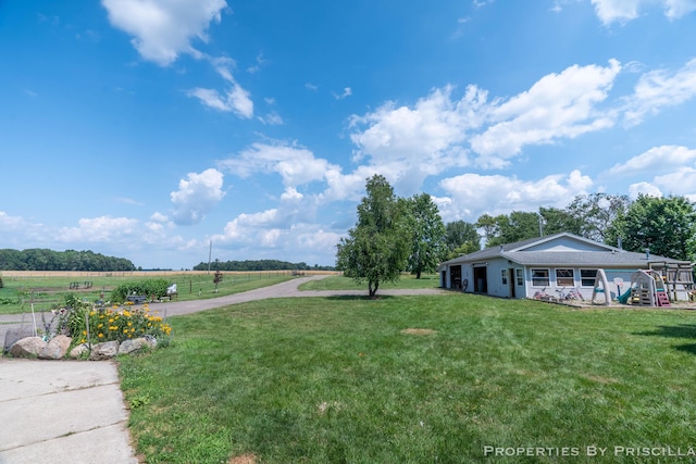 9265 Mulliken Rd, Mulliken, MI 48861 - view of grassy yard featuring a view of countryside
