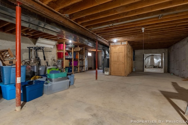 9265 Mulliken Rd, Mulliken, MI 48861 - unfinished basement featuring gas water heater
