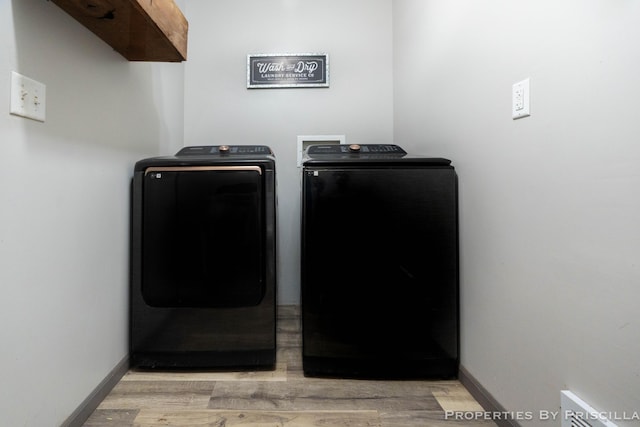 9265 Mulliken Rd, Mulliken, MI 48861 - laundry area with washing machine and dryer and light wood-style flooring