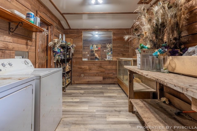 9265 Mulliken Rd, Mulliken, MI 48861 - washroom featuring wood walls, light wood-type flooring, and washer and dryer
