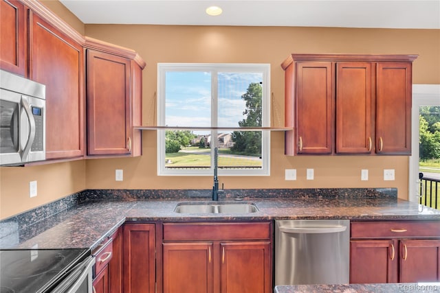 6119 Amber Ln, Grand Blanc, MI 48439 - kitchen featuring appliances with stainless steel finishes, recessed lighting, and dark stone countertops