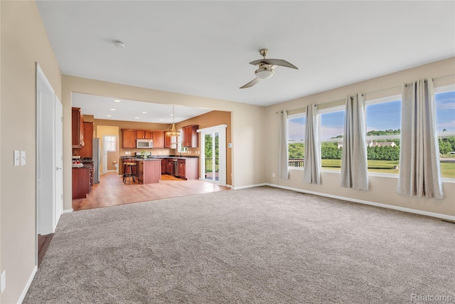 6119 Amber Ln, Grand Blanc, MI 48439 - unfurnished living room featuring light colored carpet, a ceiling fan, and recessed lighting