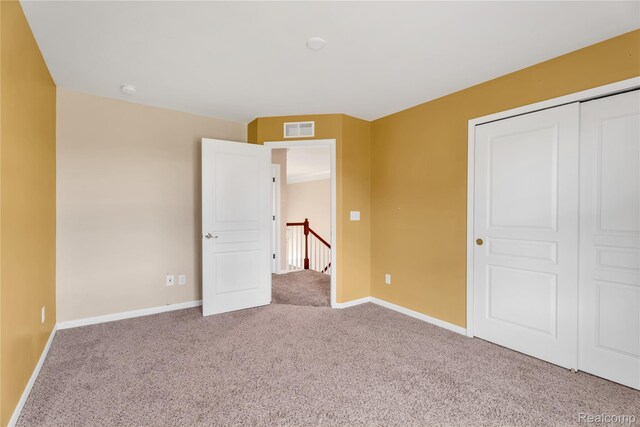 6119 Amber Ln, Grand Blanc, MI 48439 - unfurnished bedroom with carpet and a closet