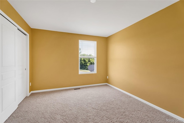 6119 Amber Ln, Grand Blanc, MI 48439 - unfurnished bedroom featuring carpet and a closet