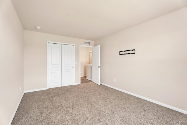 6119 Amber Ln, Grand Blanc, MI 48439 - unfurnished bedroom featuring carpet floors and a closet