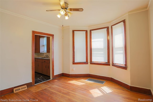 15251 Maplewood Ave, Eastpointe, MI 48021 - spare room with light wood-type flooring, ornamental molding, and a ceiling fan