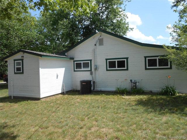 8027 Lakeshore Rd, Lexington, MI 48450 - back of house with a lawn