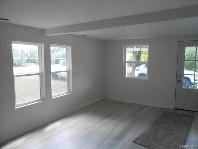 8027 Lakeshore Rd, Lexington, MI 48450 - spare room with wood finished floors and beamed ceiling