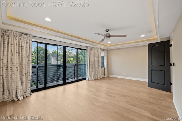 722 E Parent Ave, Royal Oak, MI 48067 - empty room featuring a tray ceiling, ceiling fan, wood finished floors, and recessed lighting