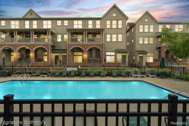 182 Amys Walk, Auburn Hills, MI 48326 - back of house featuring a community pool, a balcony, and a patio area