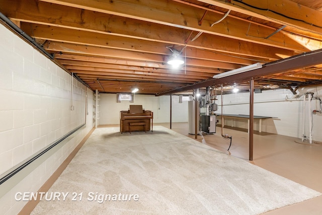 2936 Reppuhn Dr, Saginaw, MI 48603 - finished below grade area featuring water heater, a heating unit, and concrete block wall