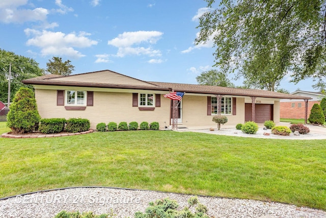 2936 Reppuhn Dr, Saginaw, MI 48603 - ranch-style house with an attached garage, a front yard, driveway, and brick siding