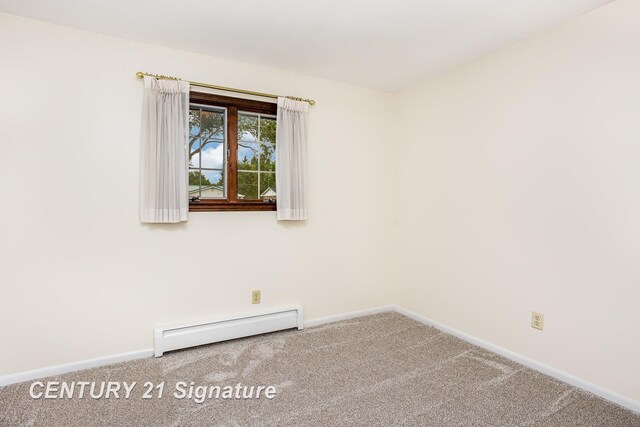 2936 Reppuhn Dr, Saginaw, MI 48603 - carpeted empty room with baseboard heating and baseboards