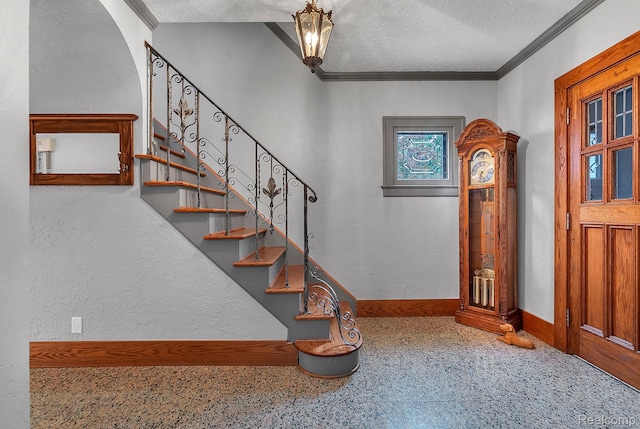 648 S Highland St, Dearborn, MI 48124 - staircase with crown molding, a textured ceiling, arched walkways, speckle patterned floor, and a textured wall