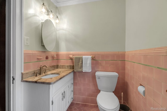 648 S Highland St, Dearborn, MI 48124 - half bath with vanity, tile walls, wainscoting, crown molding, and tile patterned floors