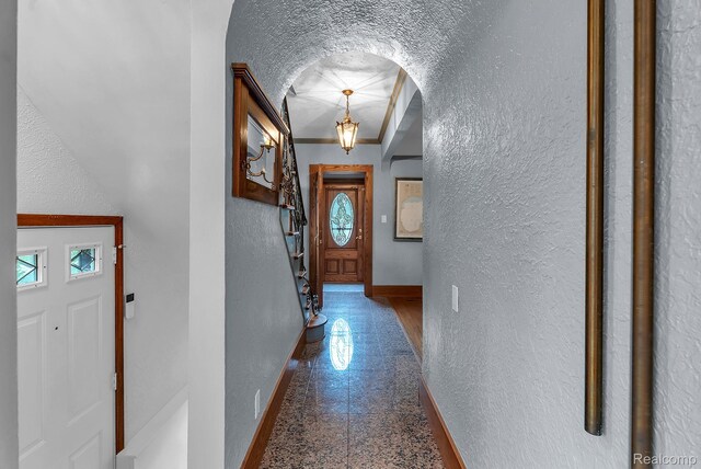 648 S Highland St, Dearborn, MI 48124 - entryway featuring a textured wall, arched walkways, granite floors, and stairs