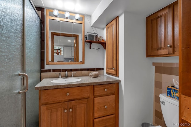 648 S Highland St, Dearborn, MI 48124 - bathroom with vanity, tile walls, a shower stall, and backsplash