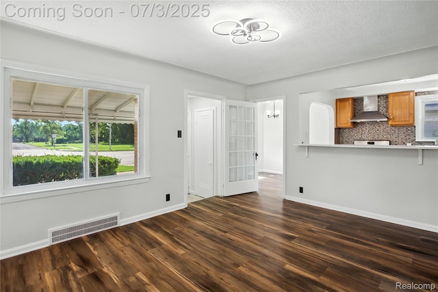 65 Martin Luther King Jr Blvd N, Pontiac, MI 48342 - unfurnished living room featuring dark wood-type flooring and baseboards