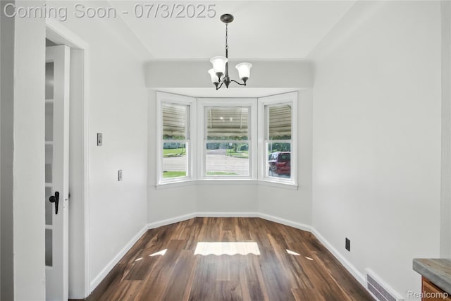 65 Martin Luther King Jr Blvd N, Pontiac, MI 48342 - unfurnished dining area with a chandelier and dark wood-style floors