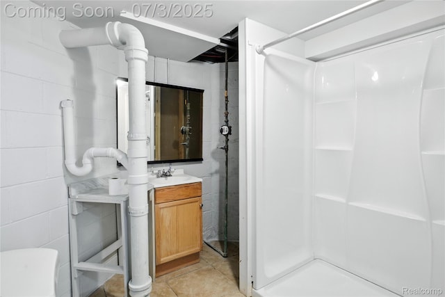 65 Martin Luther King Jr Blvd N, Pontiac, MI 48342 - bathroom featuring concrete block wall, a shower, and vanity