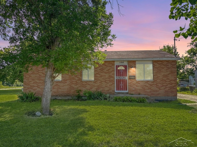 3308 Douglass St, Saginaw, MI 48601 - single story home featuring brick siding and a lawn