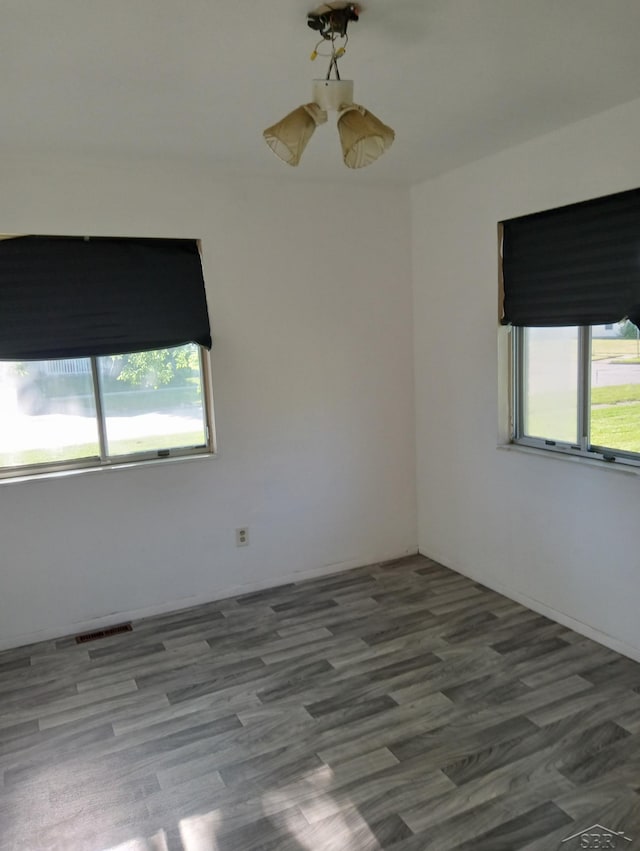 3308 Douglass St, Saginaw, MI 48601 - spare room with healthy amount of natural light and wood finished floors