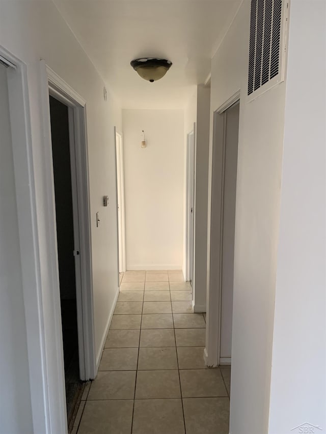3308 Douglass St, Saginaw, MI 48601 - hallway featuring light tile patterned floors and a heating unit