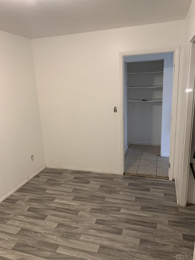 3308 Douglass St, Saginaw, MI 48601 - unfurnished room featuring wood finished floors and baseboards