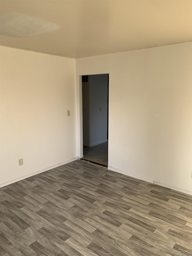 3308 Douglass St, Saginaw, MI 48601 - unfurnished room featuring wood finished floors and baseboards
