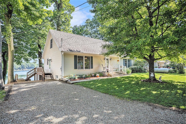 15891 Lakeview Dr, Buchanan, MI 49107 - view of front of home with a shingled roof and a front lawn