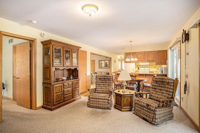 15891 Lakeview Dr, Buchanan, MI 49107 - living area with light carpet and a chandelier