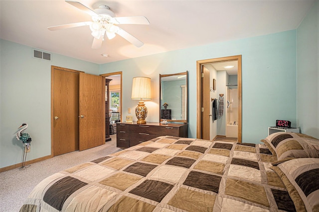 15891 Lakeview Dr, Buchanan, MI 49107 - bedroom with light carpet, a ceiling fan, and connected bathroom