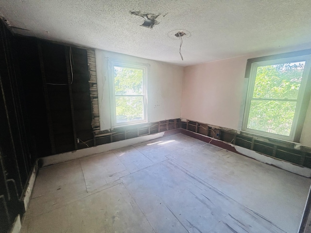 1520 E Ganson St, Jackson, MI 49202 - empty room featuring a textured ceiling