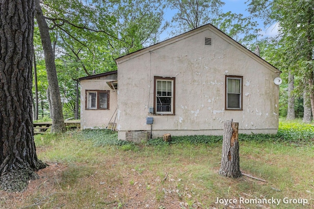 5752 E 52nd St, Newaygo, MI 49337 - view of home's exterior with stucco siding