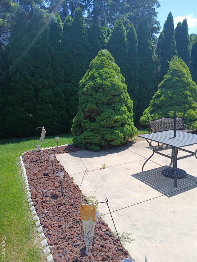 8086 Pickering Pl, Westland, MI 48185 - view of home's community featuring a patio area and a view of trees