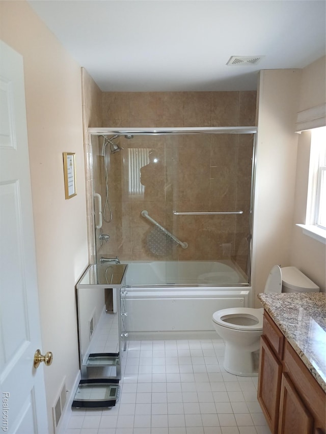 8086 Pickering Pl, Westland, MI 48185 - bathroom featuring vanity, tile patterned flooring, and bath / shower combo with glass door