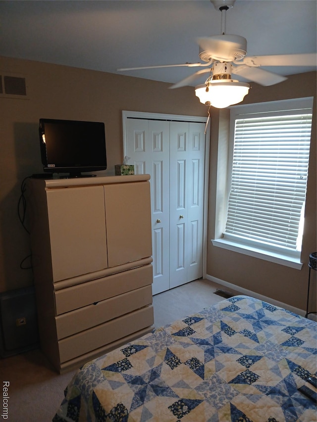 8086 Pickering Pl, Westland, MI 48185 - bedroom featuring light carpet, a closet, and a ceiling fan