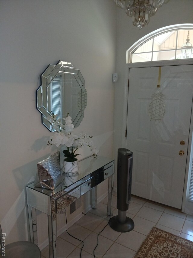 8086 Pickering Pl, Westland, MI 48185 - foyer entrance with a chandelier and light tile patterned flooring