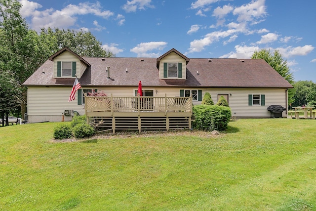 5772 Greensboro Way, Gladwin, MI 48624 - rear view of house featuring a deck, a yard, and a shingled roof
