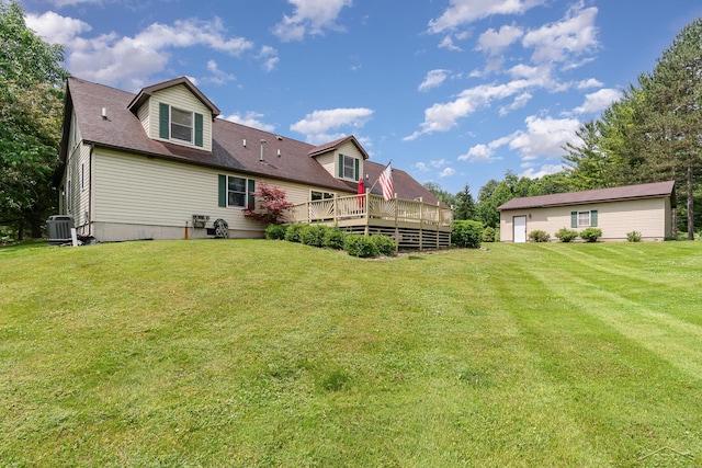 5772 Greensboro Way, Gladwin, MI 48624 - back of house with a wooden deck and a lawn