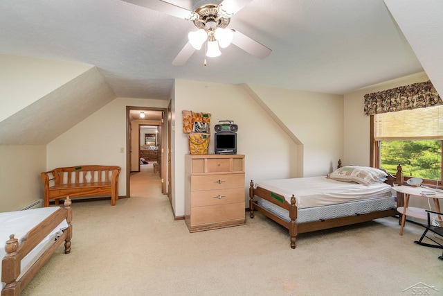 5772 Greensboro Way, Gladwin, MI 48624 - bedroom featuring light carpet, ceiling fan, and a baseboard heating unit