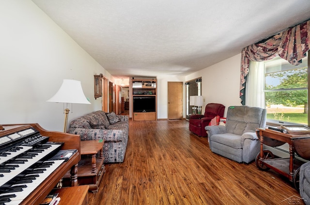 5772 Greensboro Way, Gladwin, MI 48624 - living area with wood finished floors and a textured ceiling