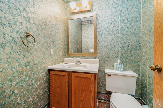 5772 Greensboro Way, Gladwin, MI 48624 - half bathroom featuring vanity and wallpapered walls