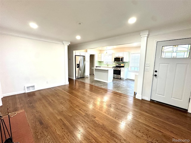 20979 Audette St, Dearborn, MI 48124 - unfurnished living room featuring dark wood finished floors, ornamental molding, and recessed lighting