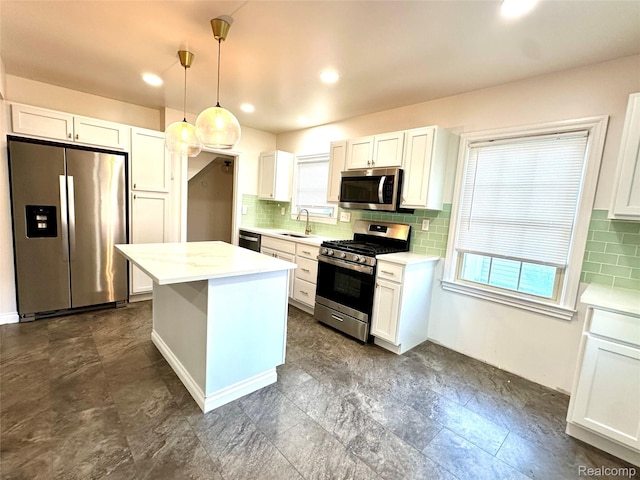 20979 Audette St, Dearborn, MI 48124 - kitchen with stainless steel appliances, plenty of natural light, backsplash, and recessed lighting