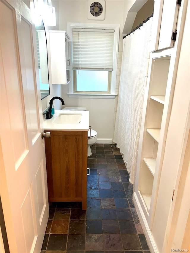 20979 Audette St, Dearborn, MI 48124 - bathroom with stone tile floors, vanity, and a shower with shower curtain