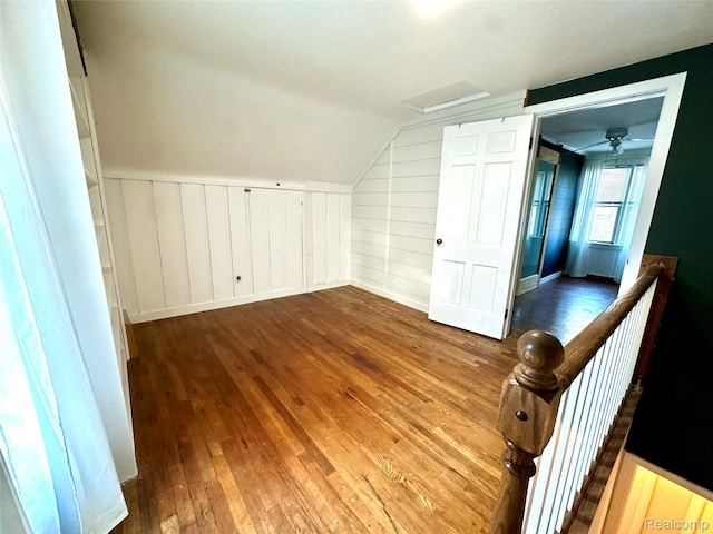 20979 Audette St, Dearborn, MI 48124 - bonus room with hardwood / wood-style floors, lofted ceiling, attic access, and a decorative wall